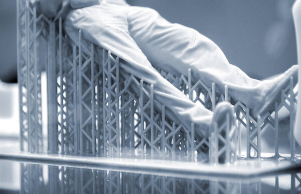 Model body of man printed on 3d printer close-up.