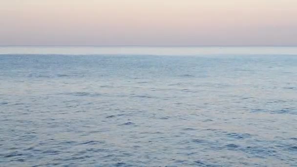 Horizon Line Surface Sea Ripples Water Clear Blue Sky Pink — Stockvideo