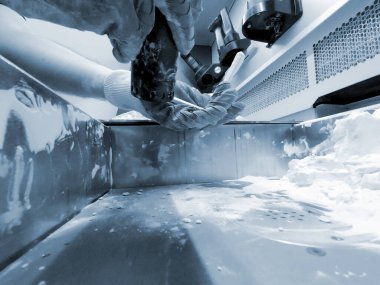 Engineer or artist designer printing 3D parts and shaping models from dust 3D print. Sculpting, creating, making. New 3D printing technologies. Multi Jet Fusion. Advanced additive technology in use.