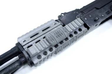 Detail of a weapon printed on a 3D printer. A weapon detail printed on a 3D printer from powder isolated on white background.