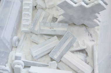 Detail objects printed on powder 3D printer and covered white polyamide powder close-up. Technology Multi Jet Fusion MJF. 3D prototype models created by new additive progressive 3d printing technology