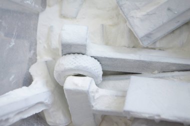 Detail objects printed on powder 3D printer and covered white polyamide powder close-up. Technology Multi Jet Fusion MJF. 3D prototype models created by new additive progressive 3d printing technology