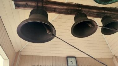 Ring the bells. Ringing church bells. Bell tower inside. Church bells ringing. Chime. Ding-dong. Bells bottom view. Ringing
