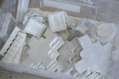 Detail objects printed on powder 3D printer and covered white polyamide powder close-up. Technology Multi Jet Fusion MJF. 3D prototype models created by new additive progressive 3d printing technology