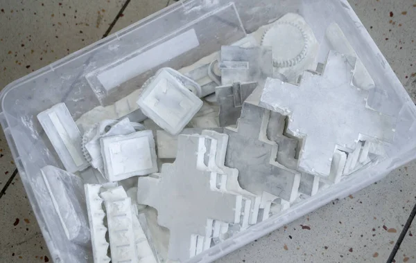 Detail objects printed on powder 3D printer and covered white polyamide powder close-up. Technology Multi Jet Fusion MJF. 3D prototype models created by new additive progressive 3d printing technology