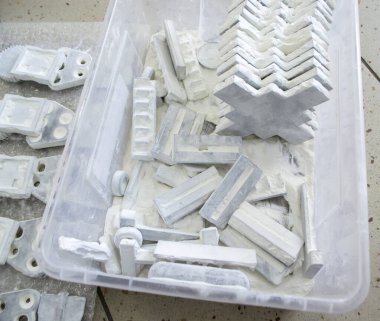 Detail objects printed on powder 3D printer and covered white polyamide powder close-up. Technology Multi Jet Fusion MJF. 3D prototype models created by new additive progressive 3d printing technology