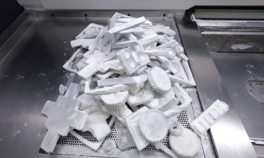 Detail objects printed on powder 3D printer and covered white polyamide powder close-up. Technology Multi Jet Fusion MJF. 3D prototype models created by new additive progressive 3d printing technology