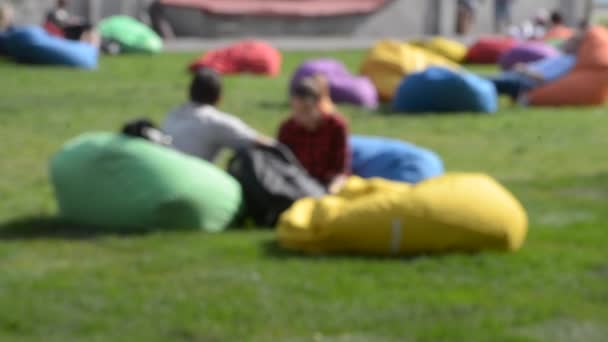 Blurred Background People Bean Bags Grass Outdoors — Stock Video