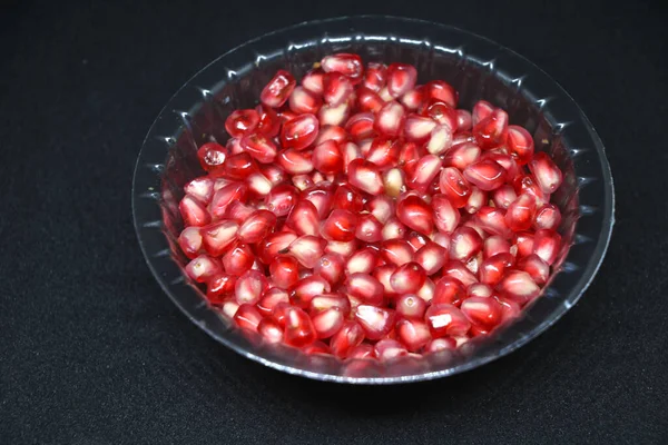 Red Fresh Pomegranate Seed Plastic Transparent Bowl Black Background — Stock Photo, Image