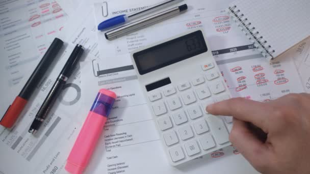 Close hand of accountant on calculator check financial report — Vídeo de Stock