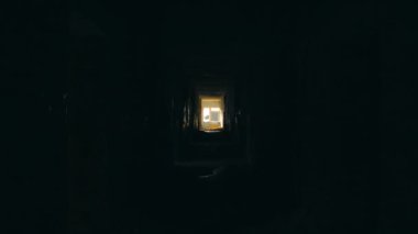 Walking down a dark long corridor