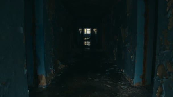Walking down long corridor in abandoned building — Video Stock