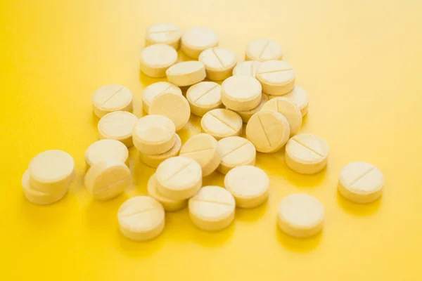 Bunch Pills Yellow Background Close — стоковое фото