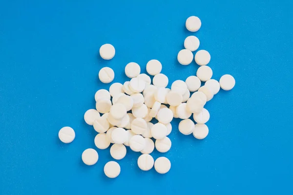 Aspirin Tablets Blue Background Close — стоковое фото