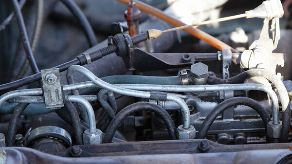 Old small car diesel motor engine fiel system with mechanical fuel pump rail system drive close-up