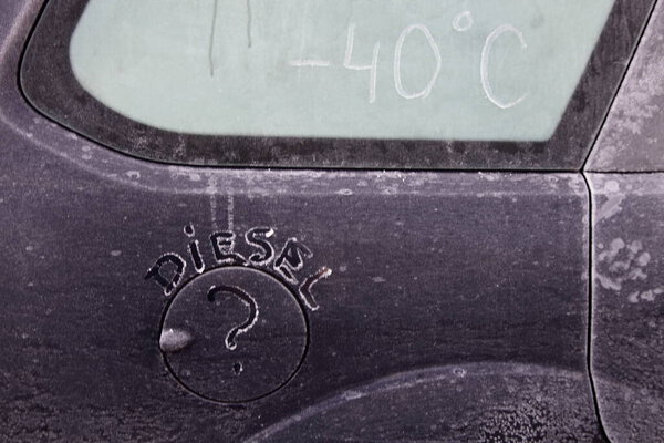Inscription DIESEL on car frozen refueling hatch, problems of starting diesel engines in the cold season temperature -40
