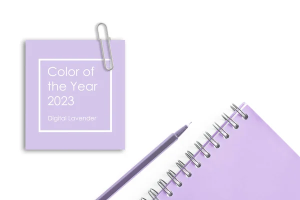 Lavender spiral planner notebook and pen over white background. Stationery flat lay. Back to school, home office. Concept of trendy lavender color. Text Color of the year 2023 Digital Lavender