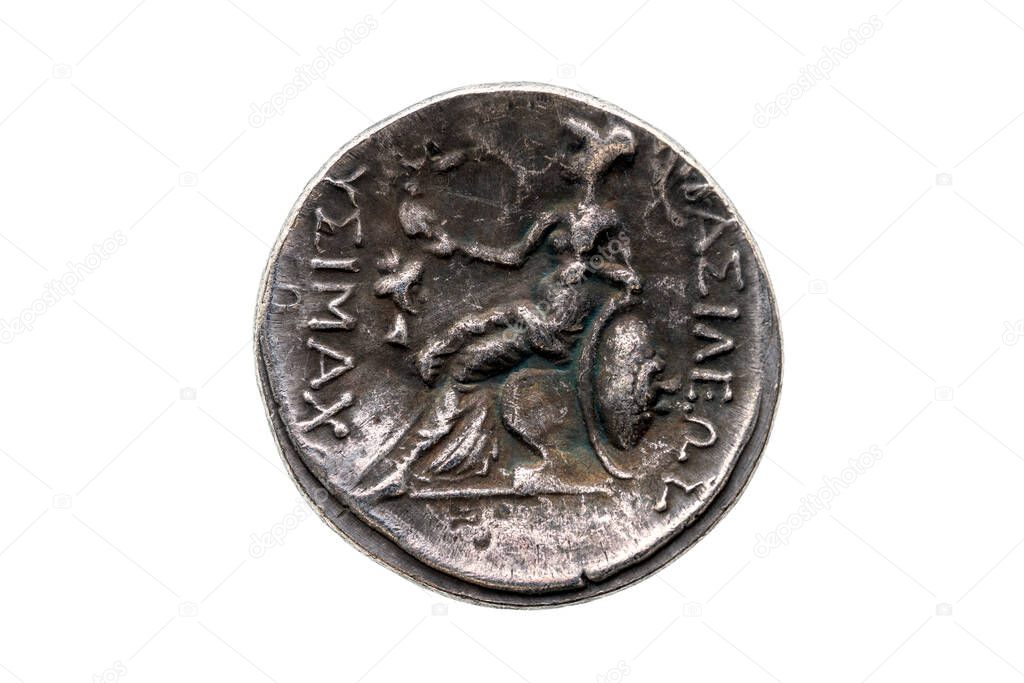 Reverse side of a Greek silver Drachum coin replica of  Alexander the Great dated from 336-323 BC cut out and isolated on a white background, stock photo image