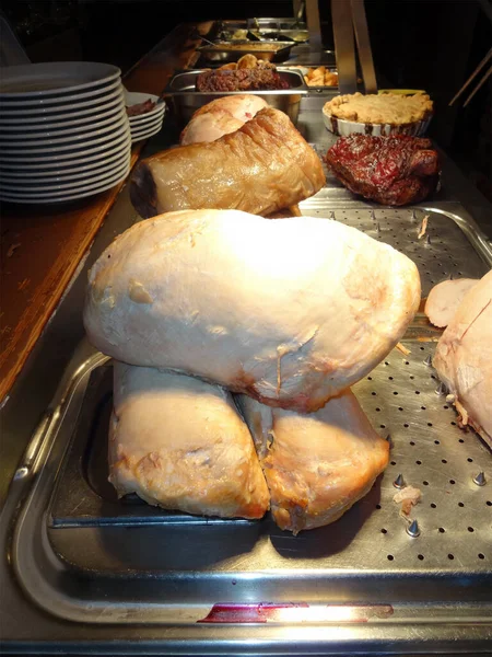 Roast beef and other meats for lunch and dinner at a buffet carvery stock photo image