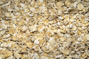 Yuvarlak yulaf ezmesi arka planında kahvaltıda sağlıklı beslendiği biliniyor.