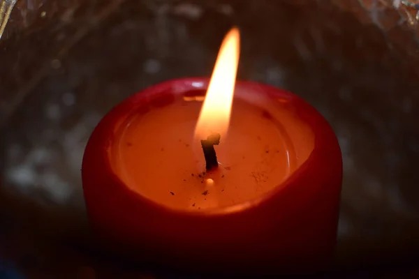 Burning red candle as a close up — Stock Photo, Image