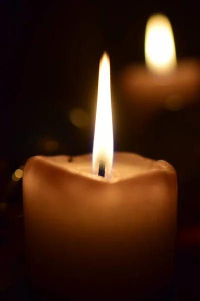 Burning beige candles as a close up — Stock Photo, Image