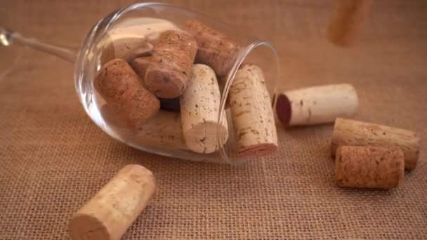 Wine Corks Fall Burlap Background Wineglass Slow Motion — стоковое видео