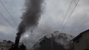 A retro steam locomotive prepares to leave the station.