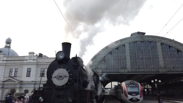 LVIV, UKRAINE - JANUARY 08, 2022: A retro steam locomotive prepares to leave the station.