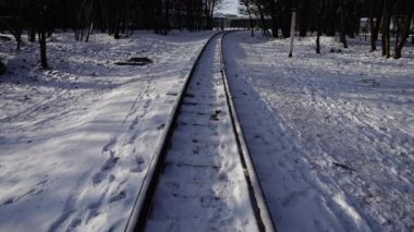 Railway rails covered with snow.