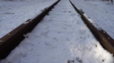 Railway rails covered with snow.