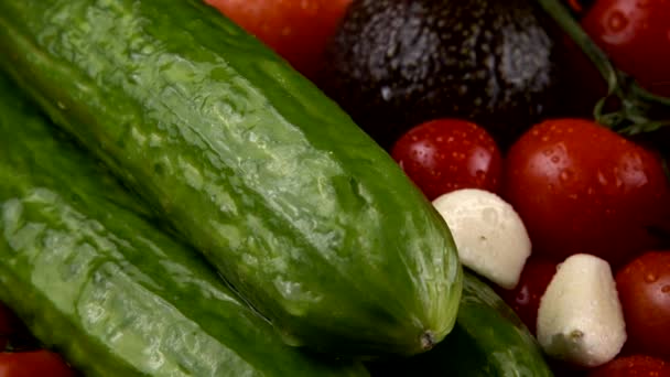 Cherry Tomatoes Cucumbers Garlic Avocado Red Onion Black Background Water — Stock Video