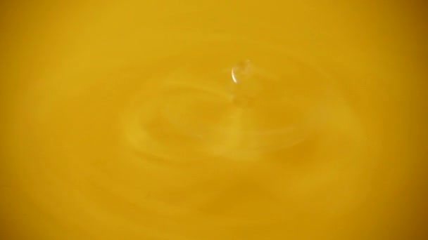 Drops Water Fall Orange Background Slow Motion — Stock Video
