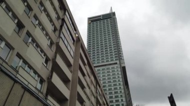 Warsaw, Poland.  The Mirow district. It is a developing business environment, where modern skyscrapers, including the Warsaw Spire, alternate with pre-war ruins and graffiti-painted Stalinist houses.