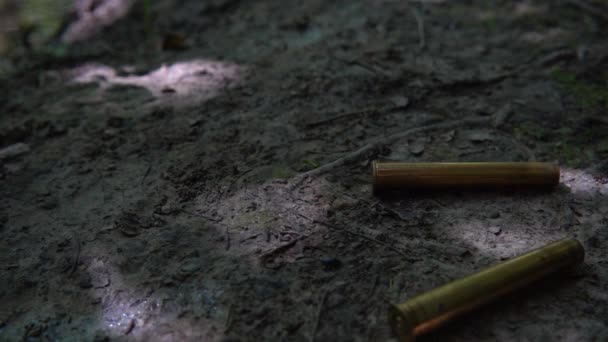 Bullet Casings Fall Ground Shooting Forest Slow Motion — Stock Video