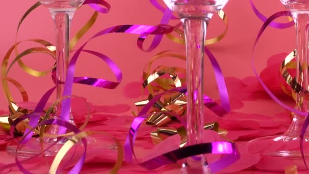 Pouring Sparkling Wine Glasses Pink Background Confetti Form Hearts Serpentine — Vídeo de stock