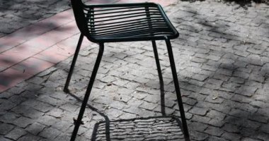 Metal chairs in a small city old European square.