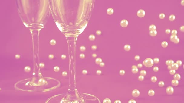 Falling White Pearls Next Wine Glasses Purple Background Slow Motion — 图库视频影像
