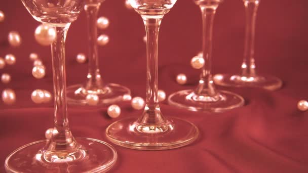 Falling White Pearls Next Wine Glasses Slow Motion — Wideo stockowe