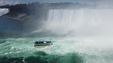 Niagara Falls. Top view on Niagara Falls and boat in time of Voyage to the Falls Boat Tour from the Canadian side of the river.