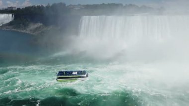Niagara Falls. Top view on Niagara Falls and boat in time of Voyage to the Falls Boat Tour from the Canadian side of the river.
