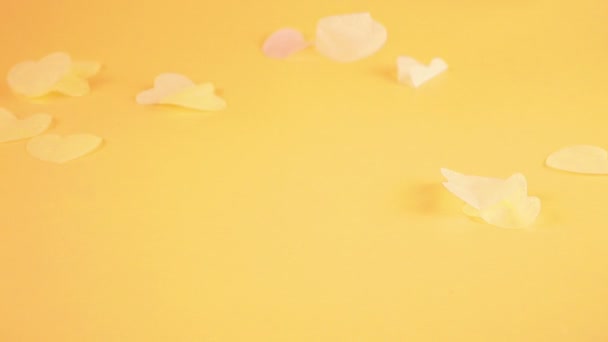 Falling Confetti Yellow Background Slow Motion — Stockvideo