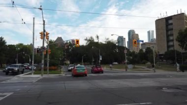 Streets, cars and pedestrian crossing in downtown Toronto, Ontario, Canada.