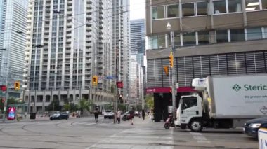 Skyscrapers, streets and pedestrian crossing in downtown Toronto, Ontario, Canada.