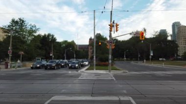 Streets, cars and pedestrian crossing in downtown Toronto, Ontario, Canada.