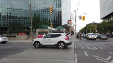Skyscrapers, streets and pedestrian crossing in downtown Toronto, Ontario, Canada.