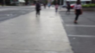 Streets, cars and pedestrian crossing in downtown Toronto, Ontario, Canada. Out of focus.