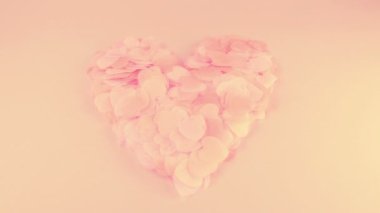 Heart-shaped confetti flies in the wind. Slow motion.