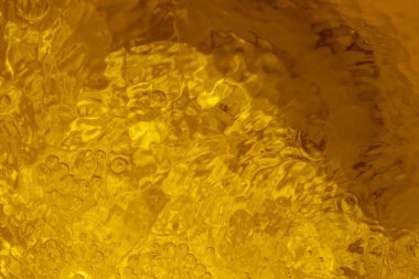 Yansımanın bulanık sarı soyut arkaplanı baloncuklu, üst manzaralı, yatay