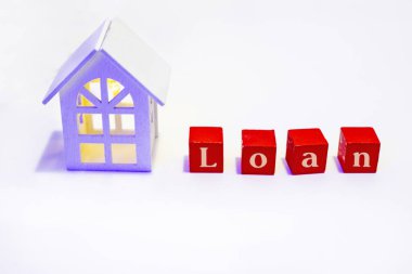 Financial loan and commercial real estate, real estate and investment concepts with a model house with luminous windows insid